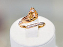 На фото Золотые кольца в Казахстане №1169: Красное золото Au585 Родирование Фианит  Аквамарин.