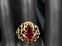На фото Золотые кольца в Казахстане №кольцо из красного золота с синтетический рубином 19 вес 3.86 г:     .