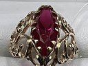 На фото Золотые кольца в Казахстане №кольцо из красного золота с синтетический рубином 19 вес 3.86 г:     .