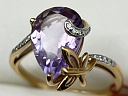 На фото Золотые кольца в Казахстане №кольцо из красного золота с аметистом и фианитом 16.5 вес 2.66 г:     .