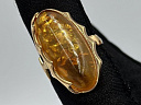 На фото Золотые кольца в Казахстане №кольцо из красного золота с янтарем 17.5 вес 5.88 г:     .